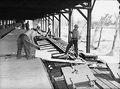 (PD) Photo: U.S. Farm Security Administration - Office of War Information Ice blocks (also called "cakes") are manually placed into reefers from a covered icing dock.[7]