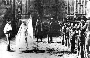 (PD) Photo: San Juan Capistrano Historical Society Mary Astor and Gilbert Roland starred in George Fitzmaurice's 1927 motion picture Rose of the Golden West, shot on location on the Mission grounds.[9] The film's penultimate scene (shown here) is set amidst the ruins of "The Great Stone Church."