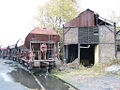 File:Abandoned coal hopper cars.jpg