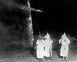 Ku Klux Klan members and a burning cross, Denver, Colorado, 1921.jpg