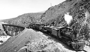 (PD) Photo: Ralph P. Stineman A San Diego and Arizona train takes a tour group over a newly constructed bridge and track section.